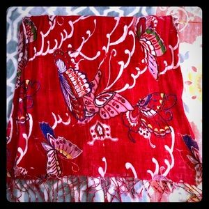 Vibrant red scarf with butterfly theme